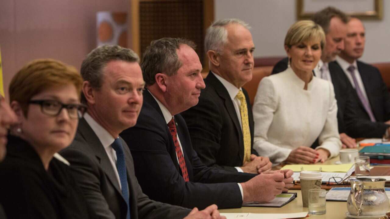 Prime Minister Malcolm Turnbull speaks with members of his ministry