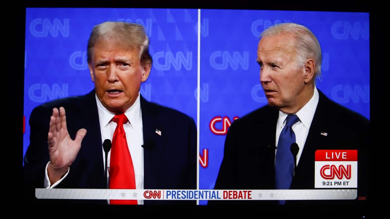 Two elderly men, Joe Biden and Donald Trump, both wearing dark suits appear on either side of a split-screen broadcast with a CNN logo in the bottom right hand corner.