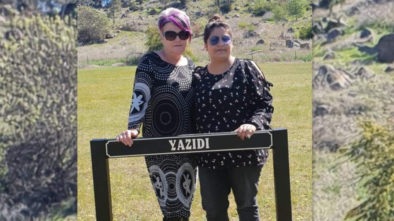 Belinda Crain and Dalal Alhasan at burial site