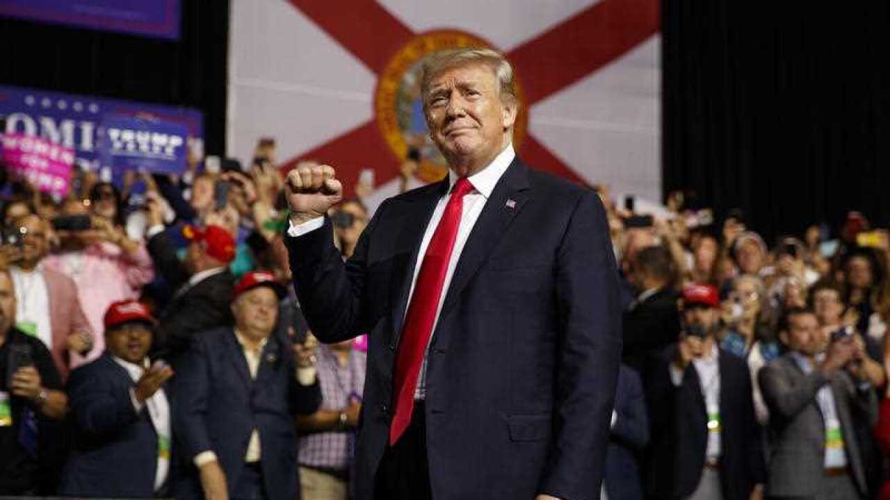 President Donald Trump arrives for a campaign rally at Florida State Fairgrounds Expo Hall, Tuesday, July 31, 2018, in Tampa, Fla.