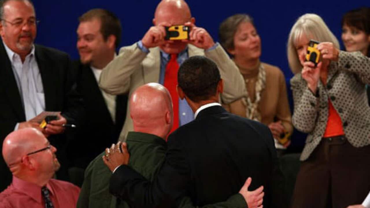 Audience snaps Obama (Getty)