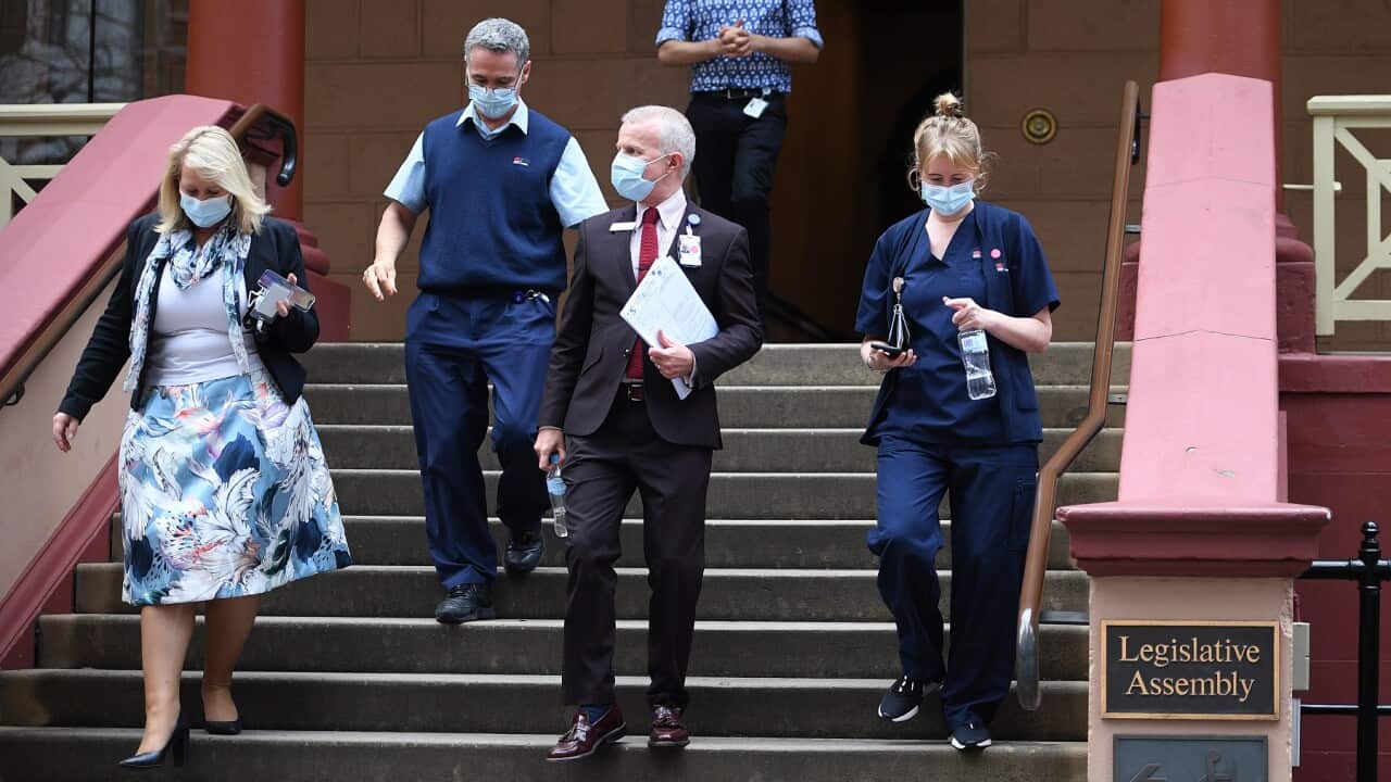 NSW Health staff leave NSW State Parliament, in Sydney, Thursday, June 24, 2021. NSW Parliament will be suspended after NSW Agriculture Minister Adam Marshall tested positive to Covid-19.(AAP Image/Dan Himbrechts) NO ARCHIVING