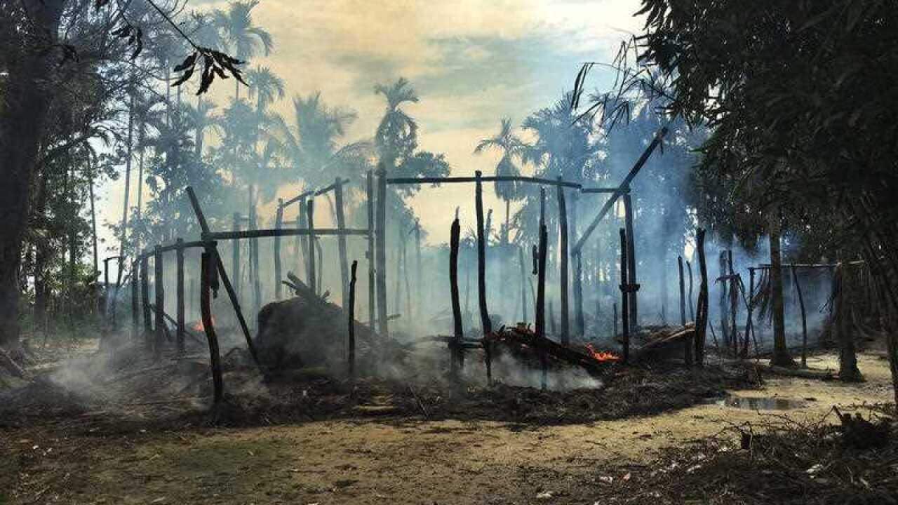 Smoke rises from a burned house in Gawdu Zara village, northern Rakhine state, Myanmar Thursday, September 7, 2017.