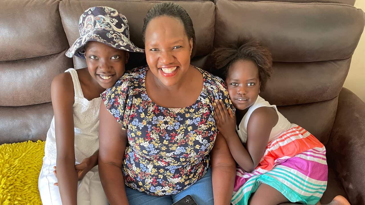 Esther Simbi with her daughters