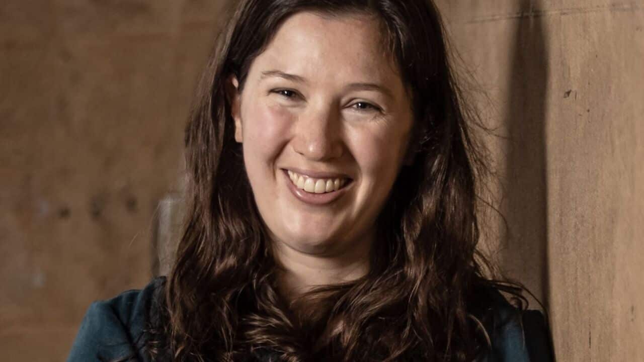 A headshot of Renee Carr smiling.
