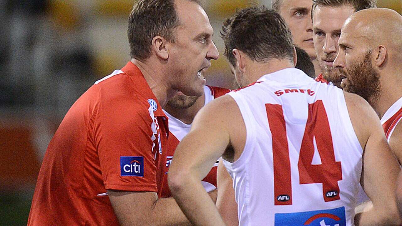 Swans coach John Longmire (left)