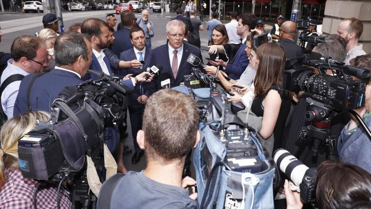 Prime Minister Scott Morrison with Matthew Guy in front of the media.
