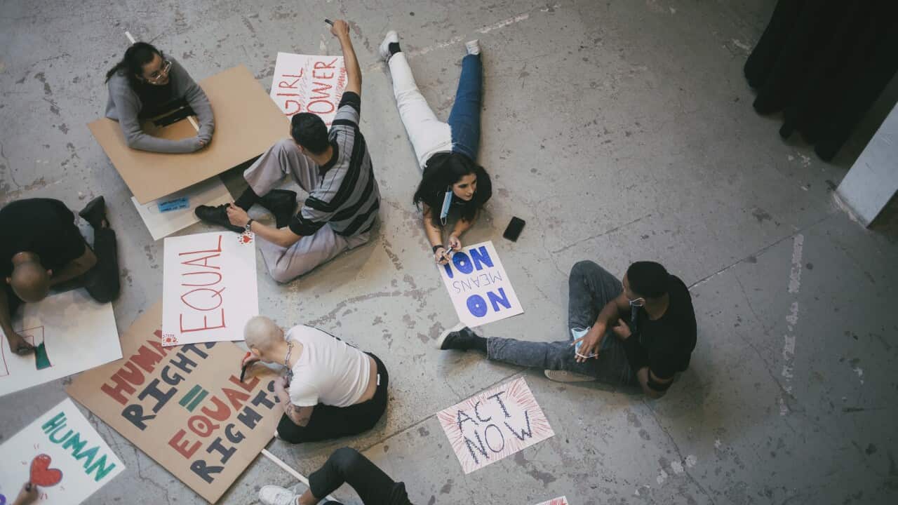 Protestors preparing signboards (Getty).