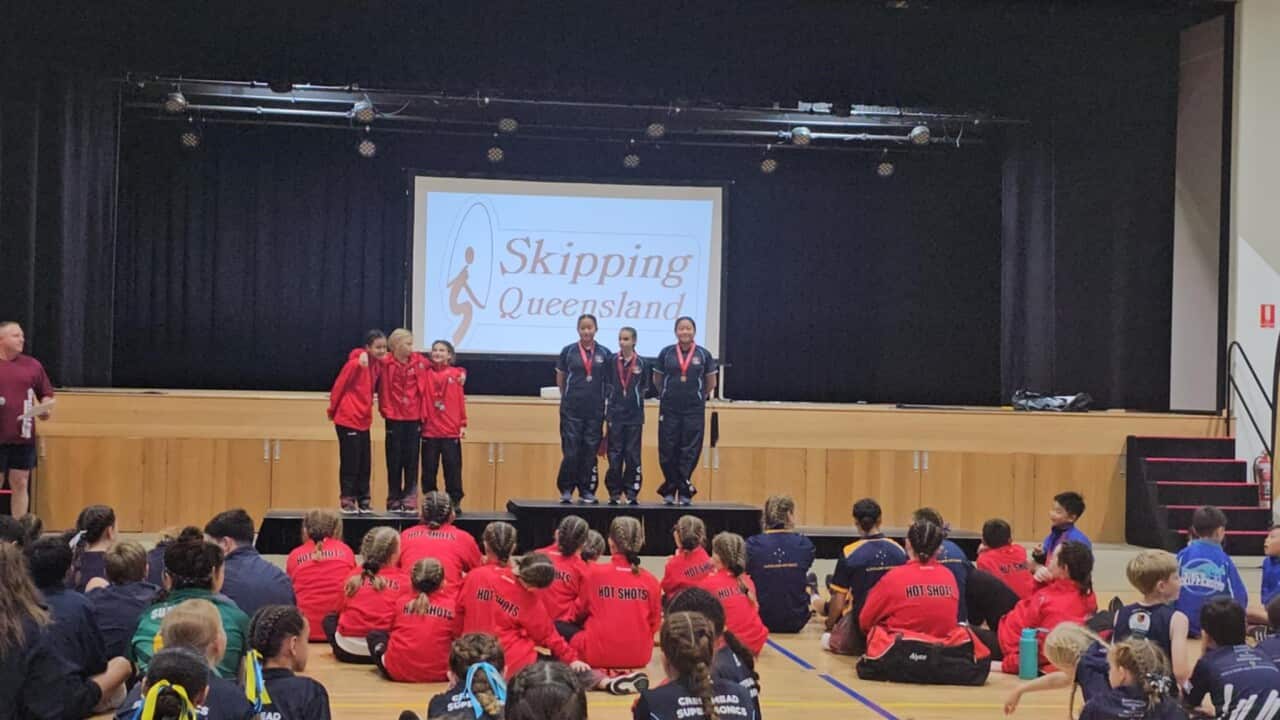 Receiving medal at the podium (May Thao).jpeg