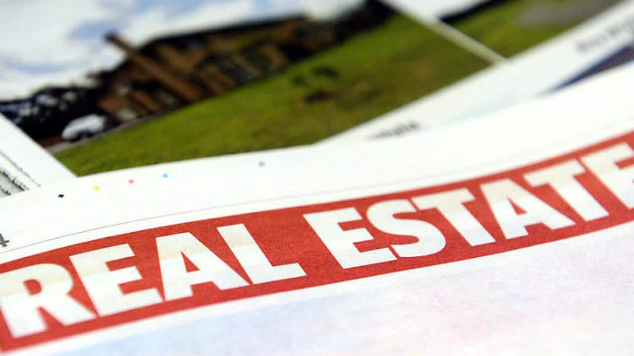 Real estate advertising in a newspaper in Brisbane, Monday, Jan. 6, 2014. (AAP Image/Dan Peled) NO ARCHIVING