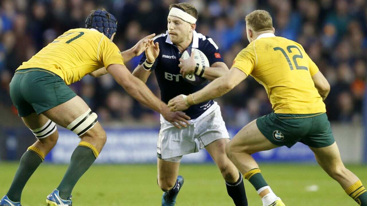 Finn Russell and Australia's Dean Mumm (L) and Reece Hodge (R)