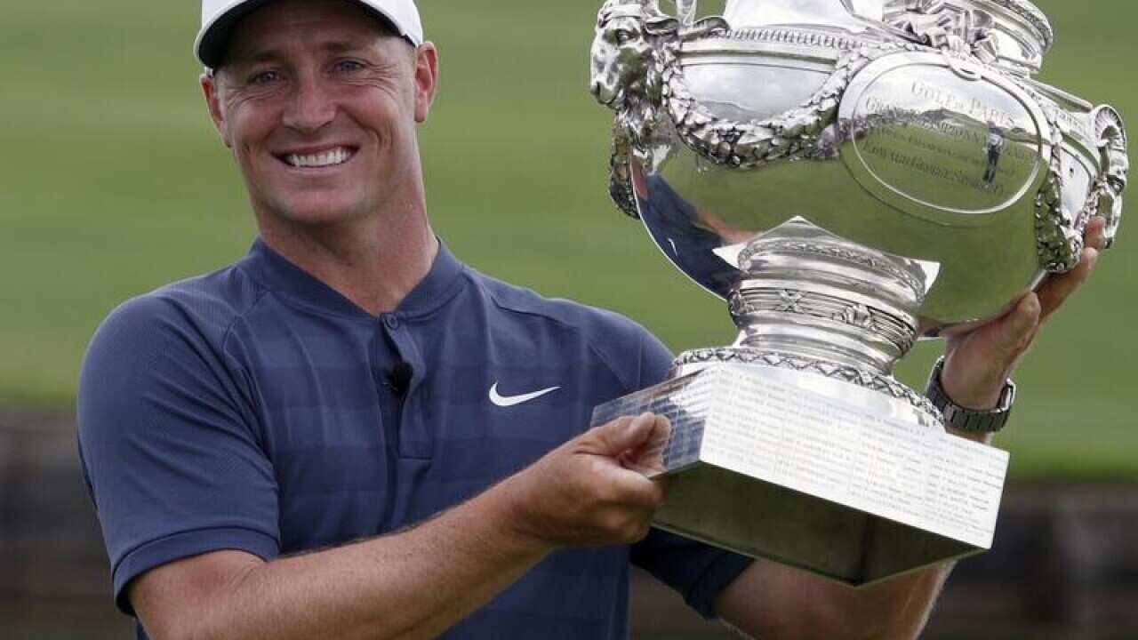 Alex Noren of Sweden holds the French Open de France Golf trophy.