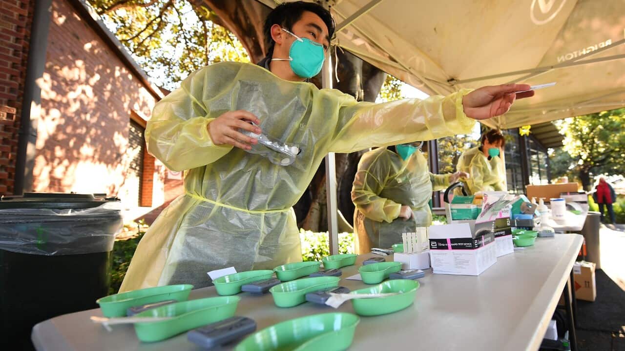 Healthcare workers are seen whilst administering COVID-19 Rapid Antigen tests on Campus at Firbank Grammar School in Brighton, Melbourne, Thursday, October 14, 2021. Firbank Grammar School is the first school to provide rapid Covid-19 testing and will sho