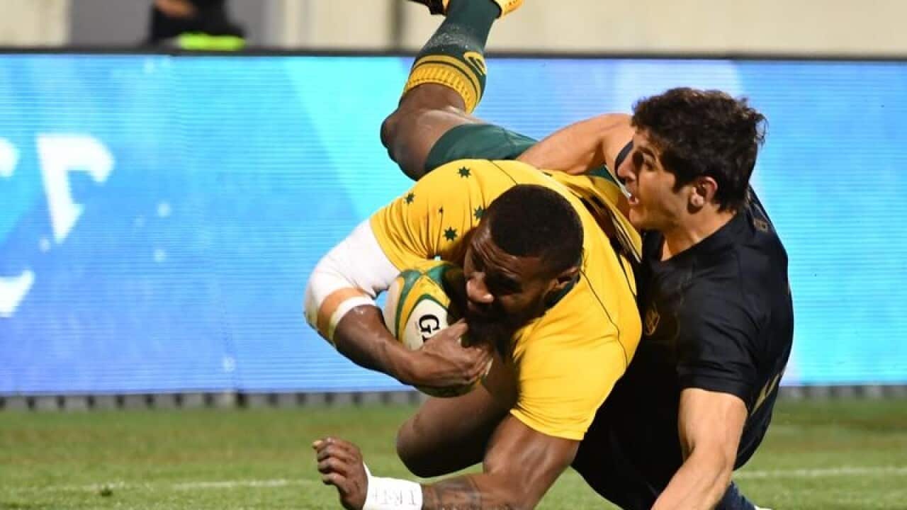Marika Koroibete of the Wallabies is tackled.