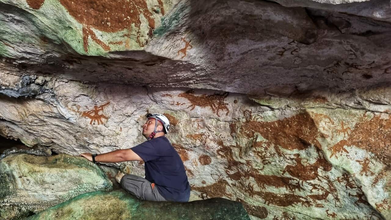 Shinatria Adhityatama working in the cave. Credit_ Supplied_Shinatria Adhityatama.jpg