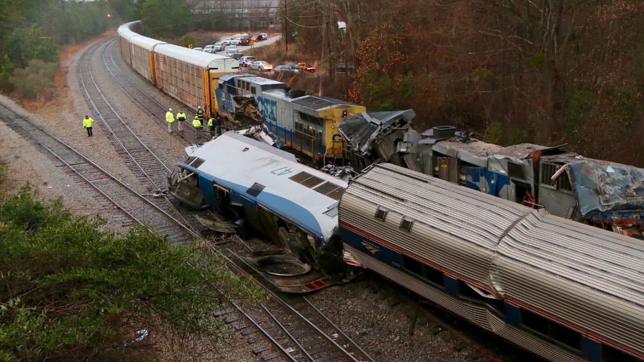 Authorities investigate the scene of a fatal Amtrak train crash in Cayce, South Carolina, Sunday, Feb. 4, 2018.