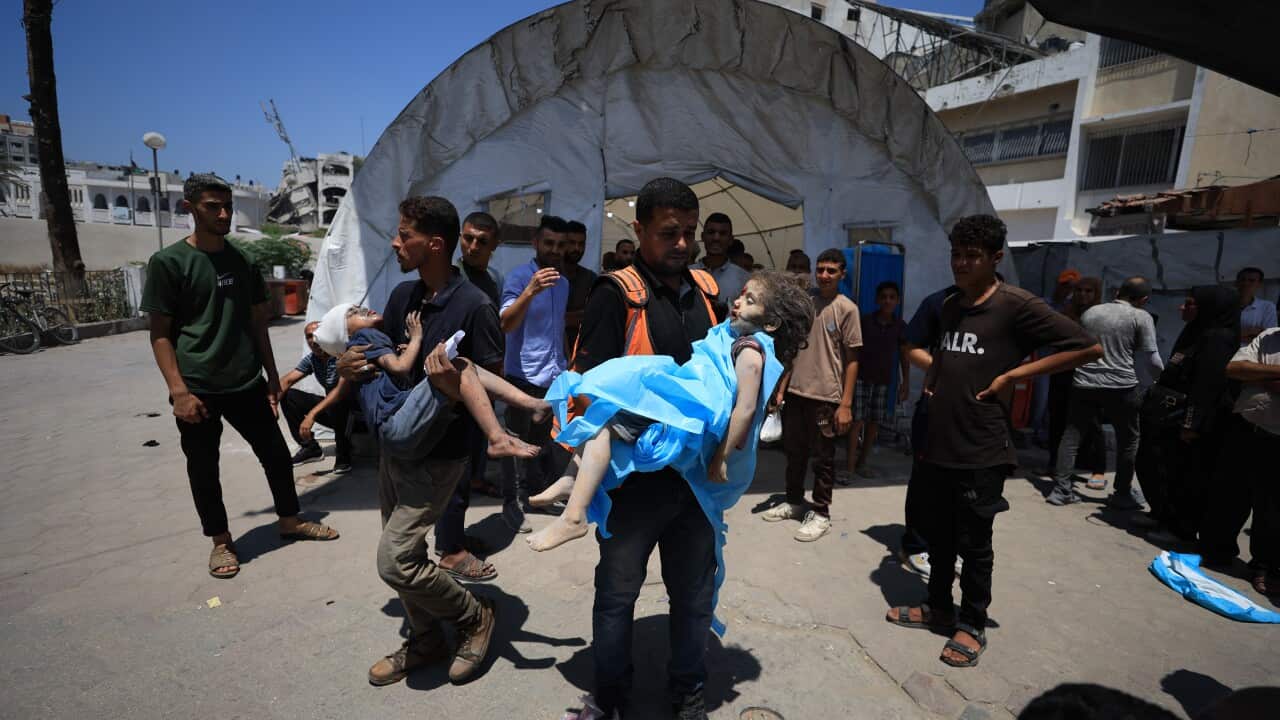 Palestinians carrying children injured in Israeli strike on Gaza last month