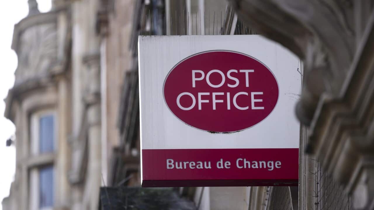 A logo of a post office is displayed in London