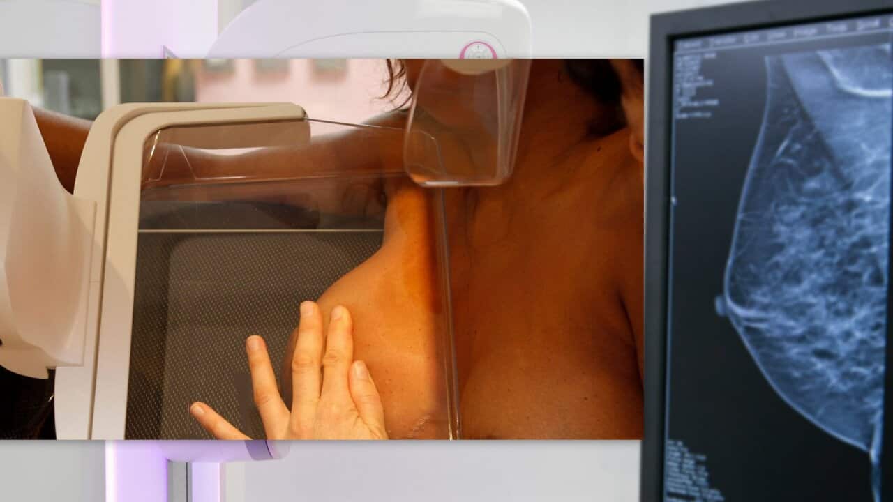 A woman is being diagnosed for breast cancer
