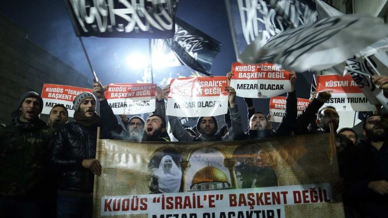 Protestors in Istanbul shouts slogans against Donald Trump as they hold banners 'Jerusalem will not be the capital, will be a grave to Israel'