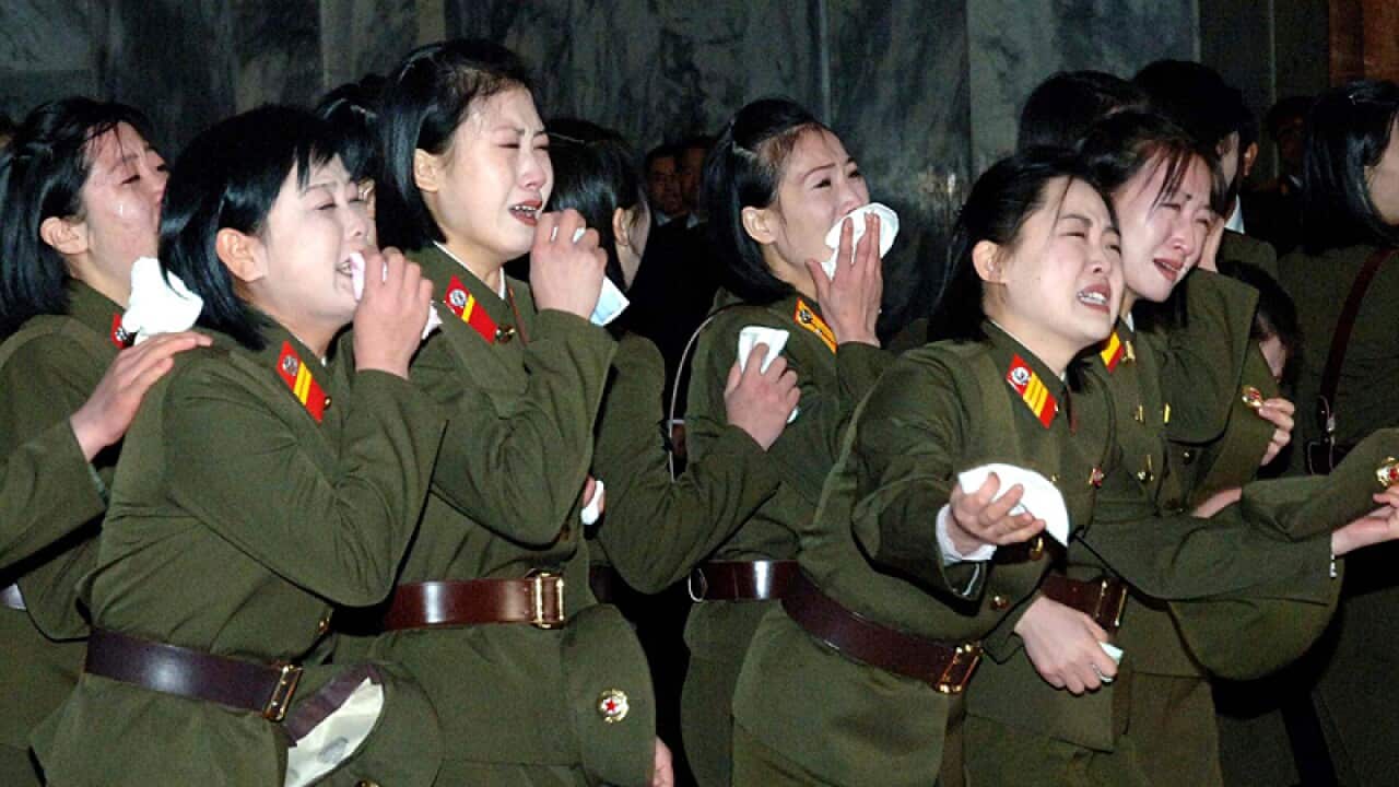 North Korean women military personnel mourn the death of late North Korean leader Kim Jong Il in front of his body at the Kumsusan Memorial Palace in Pyongyang. (AP Photo/Korean Central News Agency)