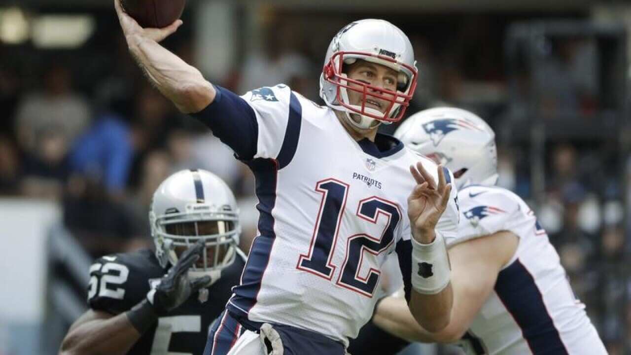 New England Patriots quarterback Tom Brady passes the ball