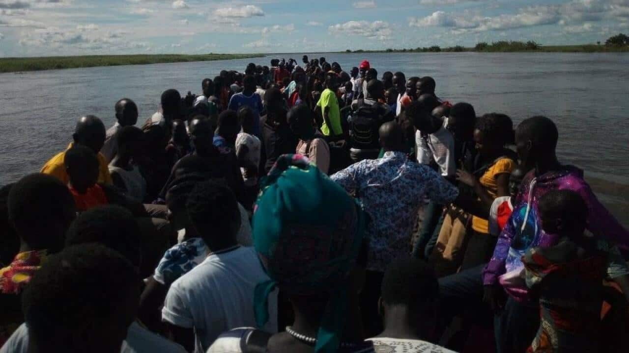 supporters of the Twic East on boat to Eastern Lake