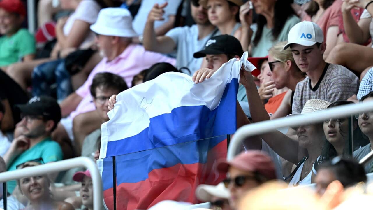 A Russian flag is displayed by spectators at the Australian Tennis Open