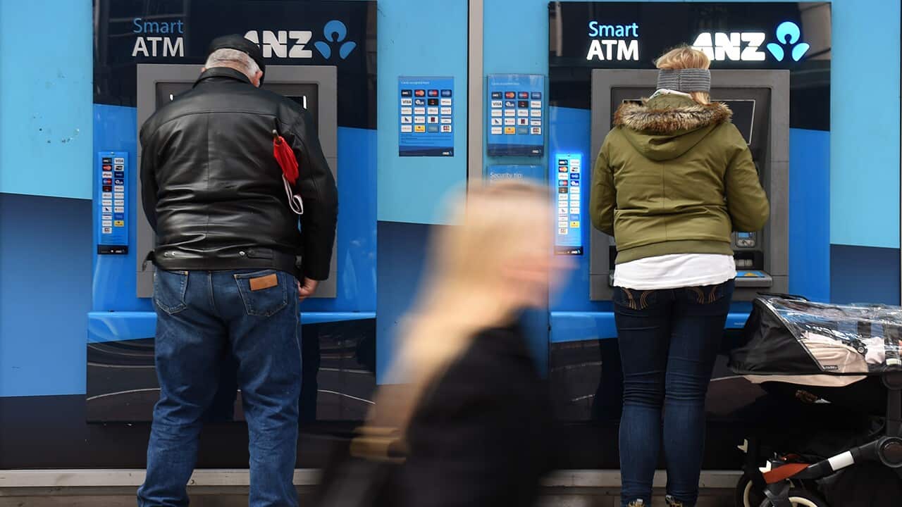 Customers use an ANZ Bank ATM in Sydney,