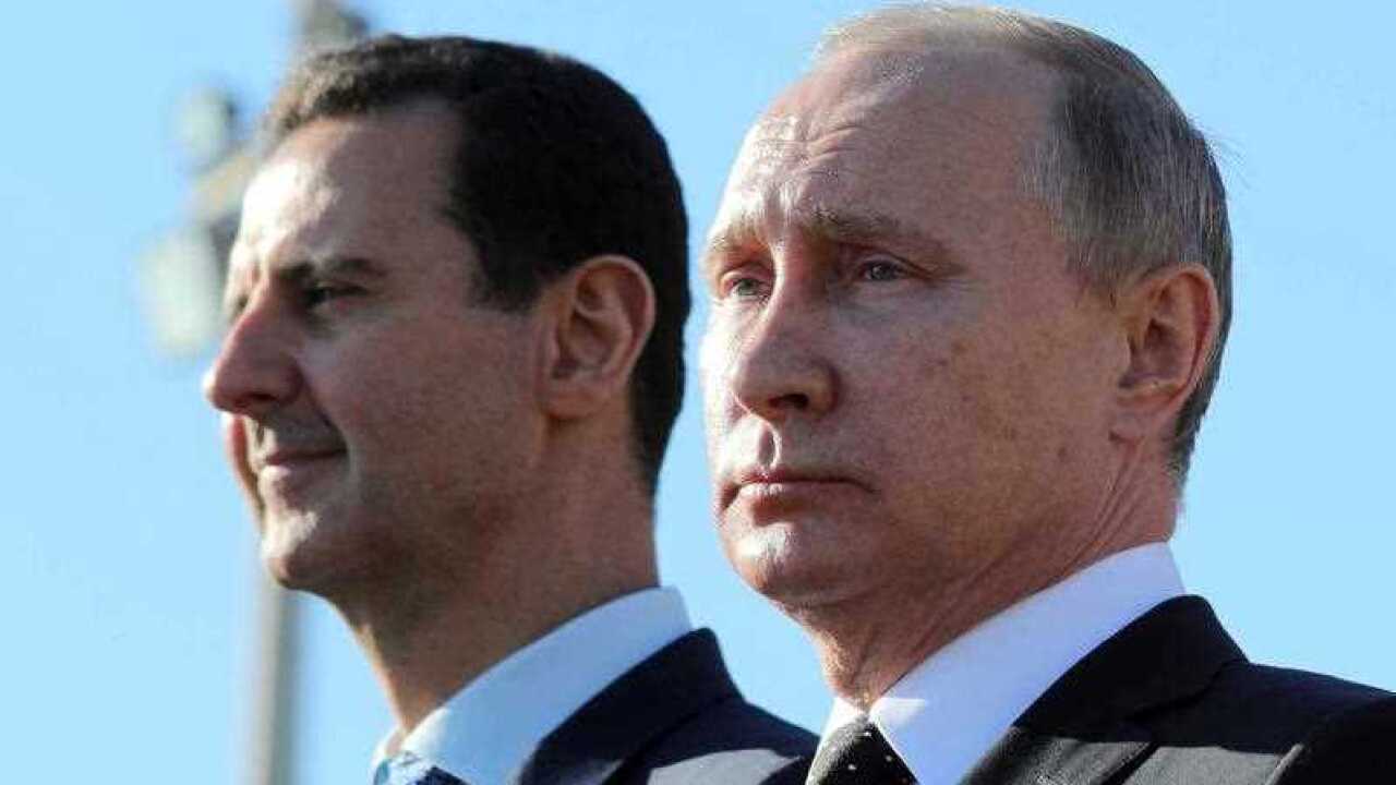 Russian President Vladimir Putin, right, and Syrian President Bashar Assad