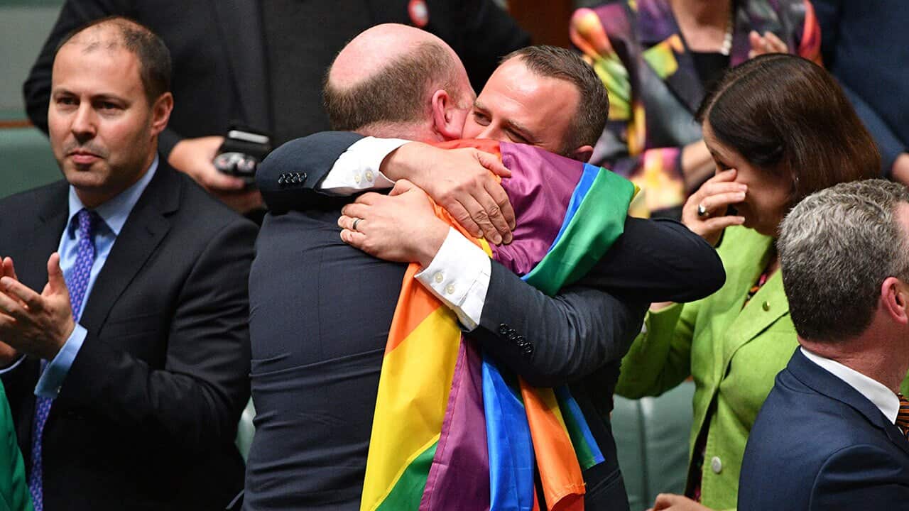 Liberal Member for North Sydney Trent Zimmerman and Liberal Member for Goldstein Tim Wilson celebrate the passing of the Marriage Amendment Bill.
