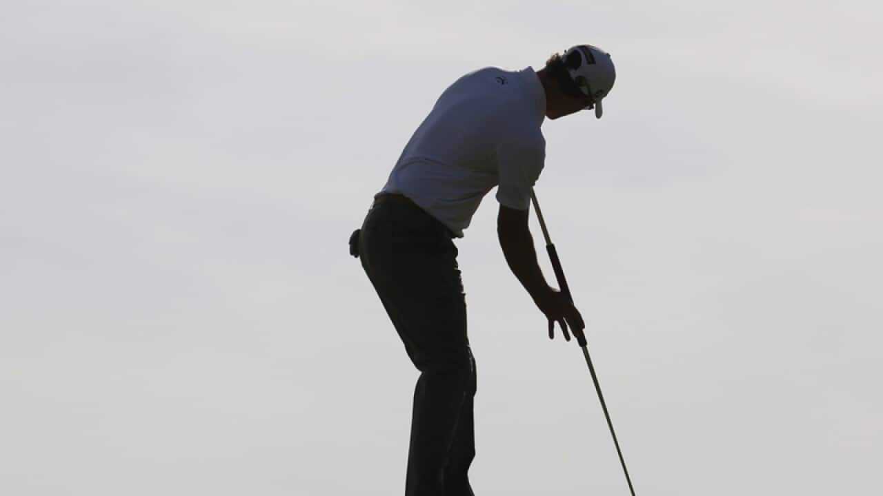 Adam Scott putts at the British Open.