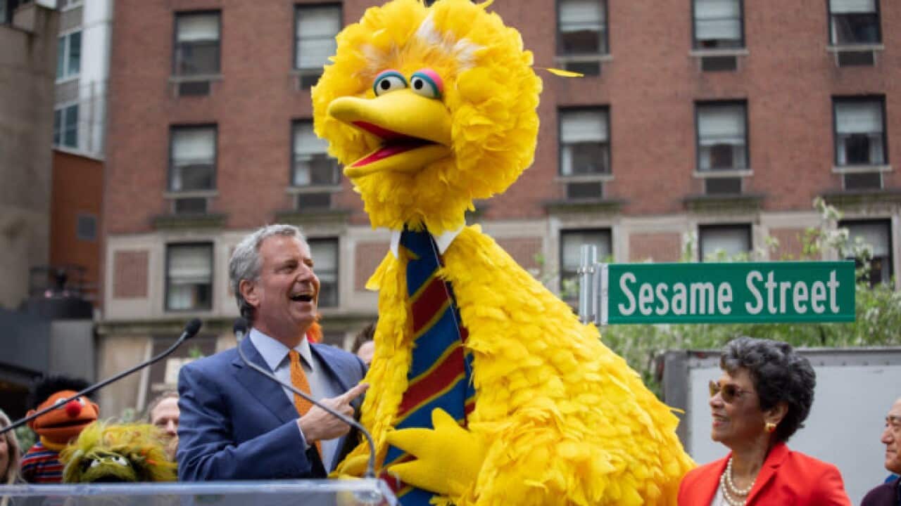 New York City Mayor Bill de Blasio with Sesame Street character Big Bird