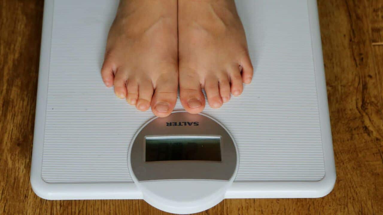A child being weighed on scales