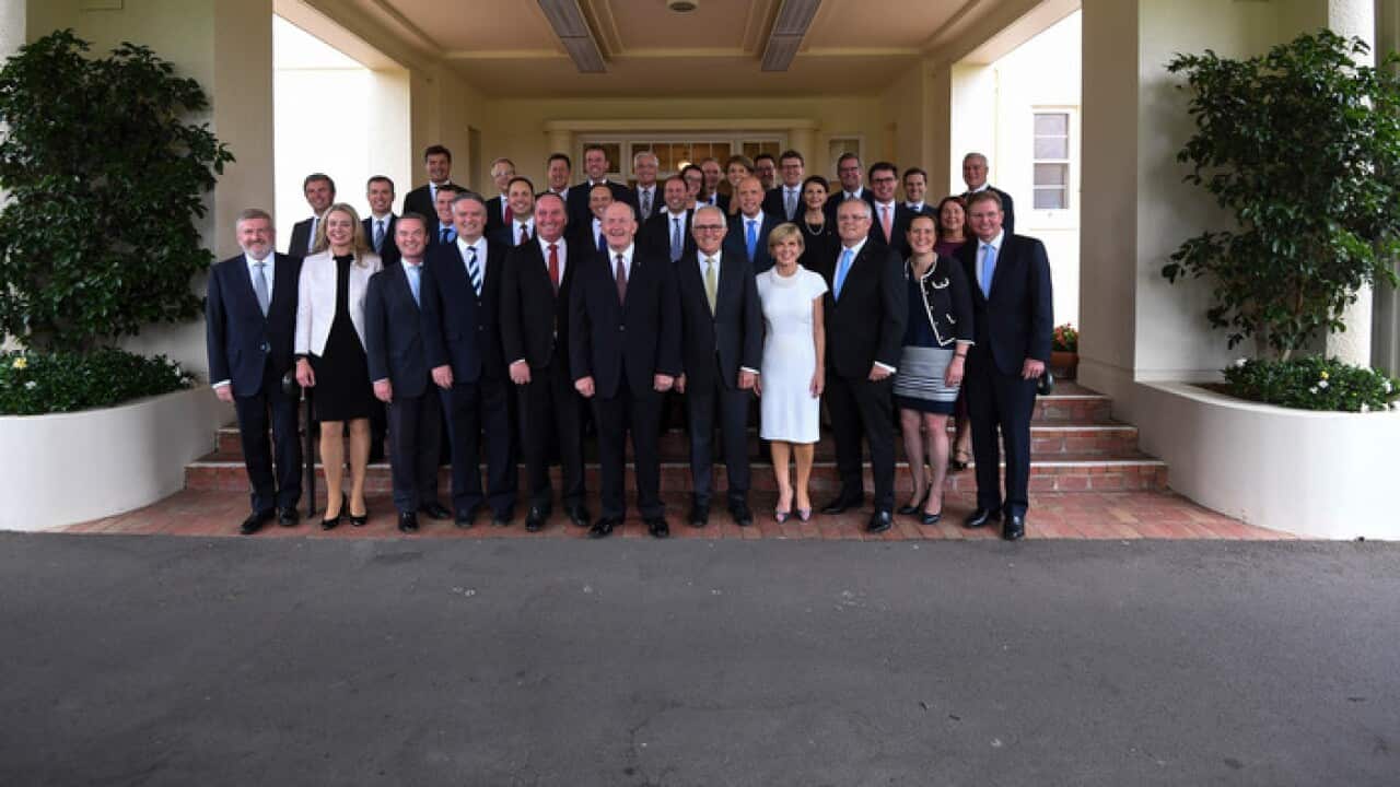 Malcolm Turnbull (centre right) poses for photographs with Ministers and Parliamentary Secretaries during a ministerial swearing-in ceremony at Government House