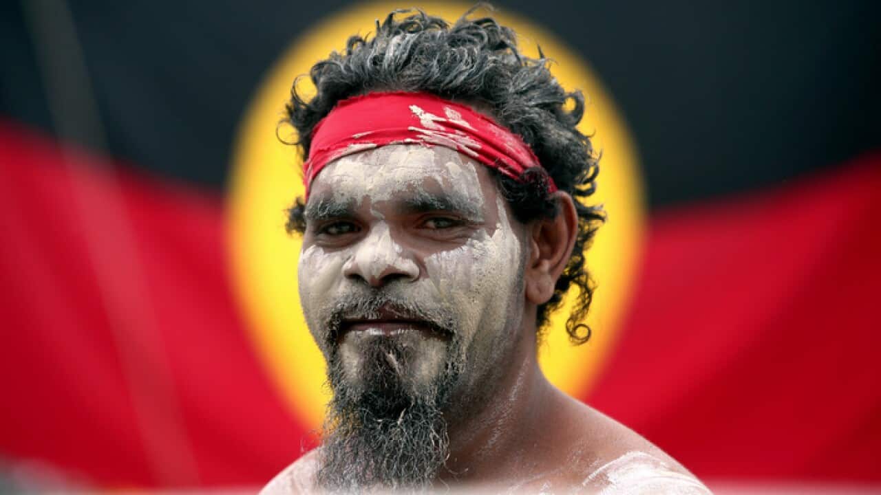 Stedman Sailor arrives with other members of the Aboriginal community to take part in a smoking ceremony as part if Australia Day celebrations in Sydney