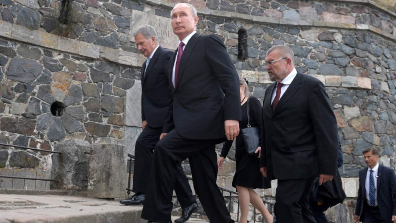 Russian President Vladimir Putin (2-L) and Finnish President Sauli Niinisto (L) visit Suomenlinna