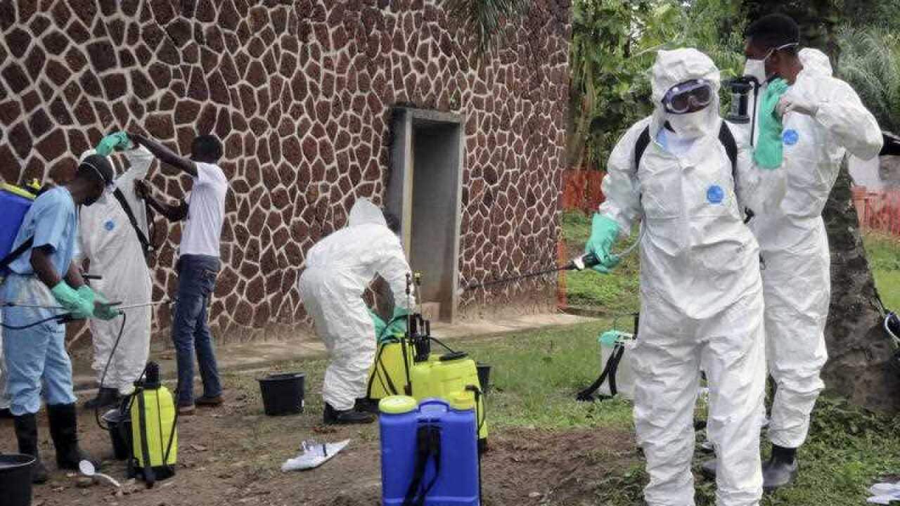 Congolese health officials prepare to disinfect people and buildings in Mbandaka, Congo.