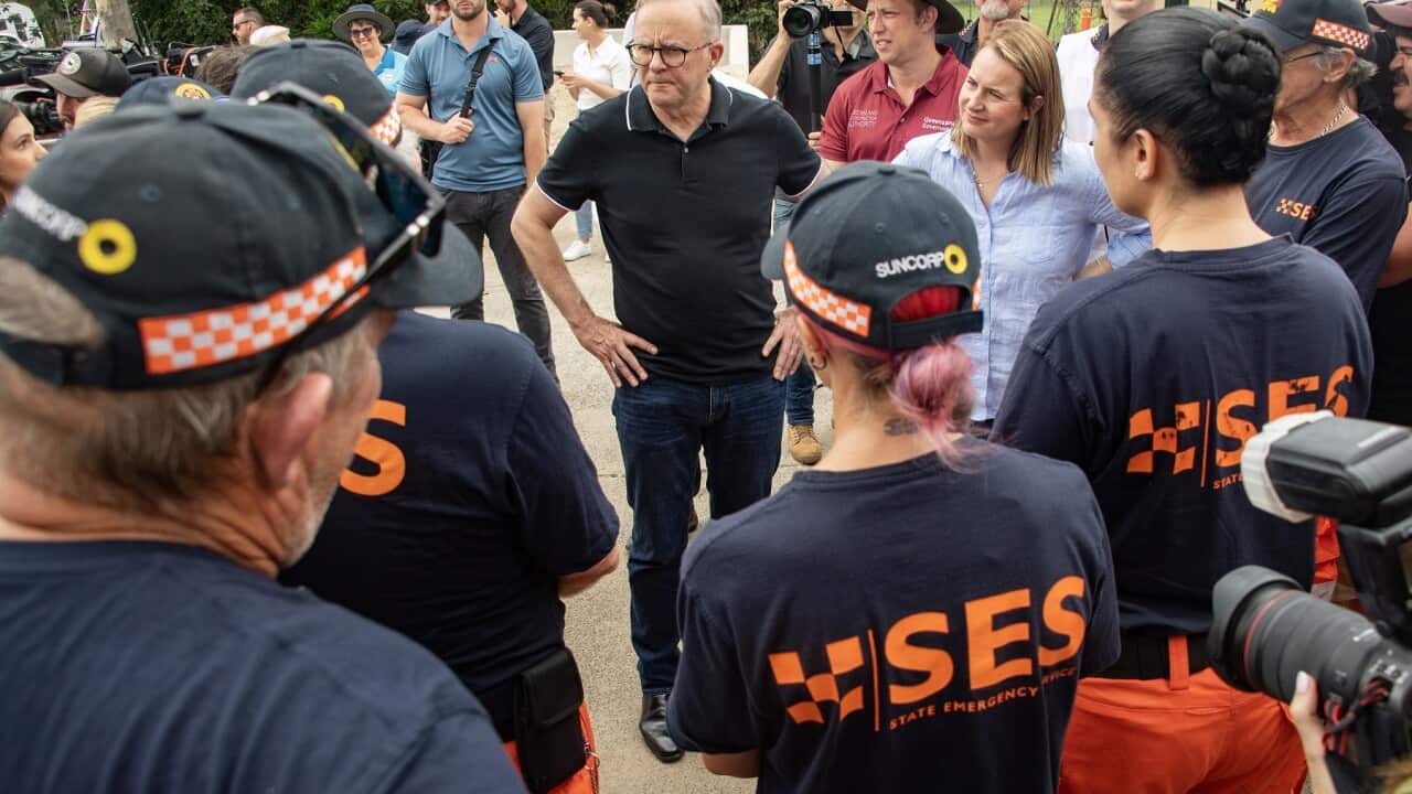 PM Anthony Albanese meets SES personnel working in the flood zone (AAP)