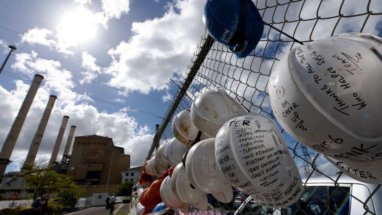 Workers hats hang on the fence outside the Hazelwood power station