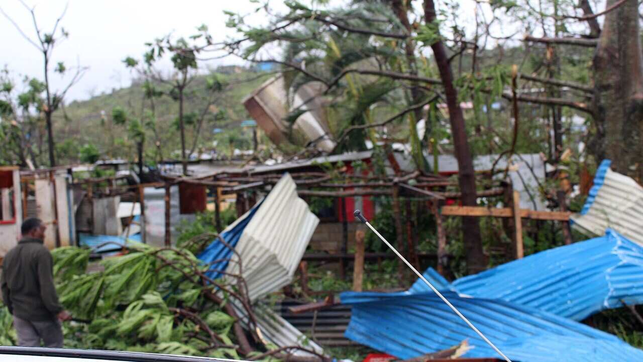 In this photo provided by non-profit organization 350.org, debris is scattered over a building in Port Vila, Vanuatu, Saturday, March 14, 2015, in the aftermath of Cyclone Pam. (AP)