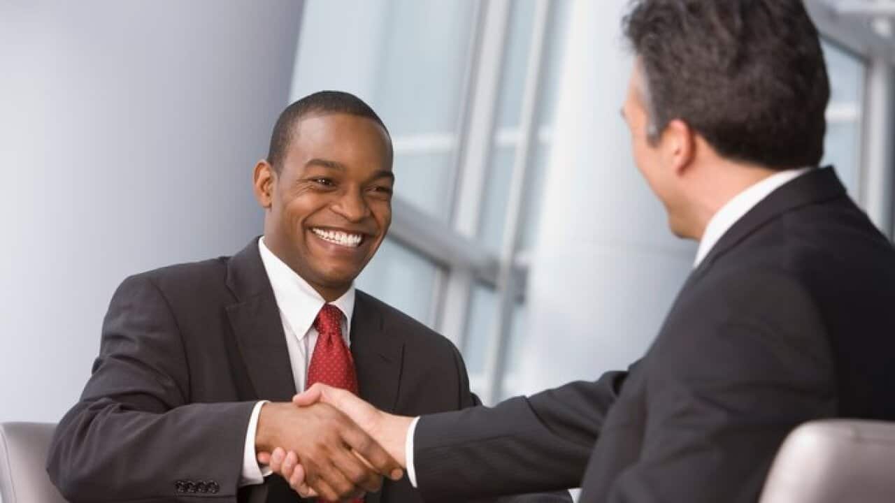 Shaking hands at a job interview