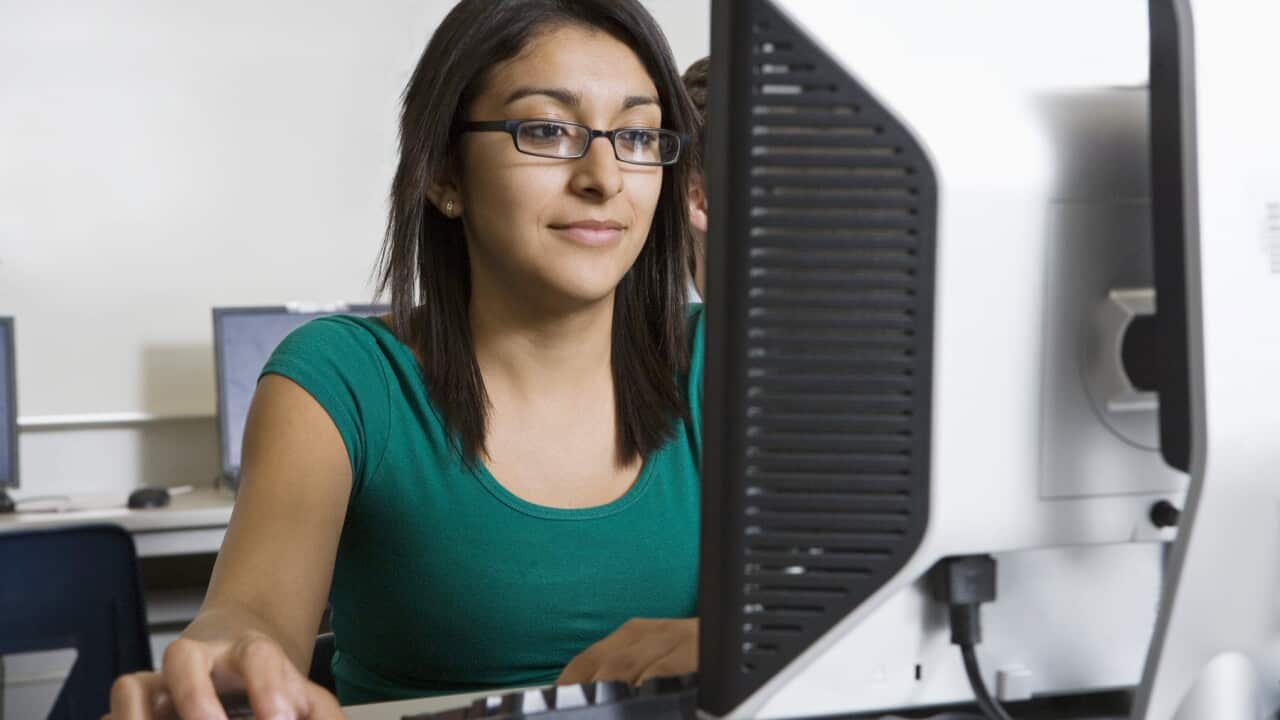 A high school student works on a computer (AAP).jpg