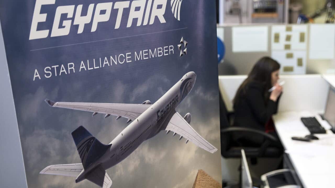 A hostess talks on the phone next to the Egyptair's desk at the Charles de Gaulle airport near Paris, France, 19 May 2016.