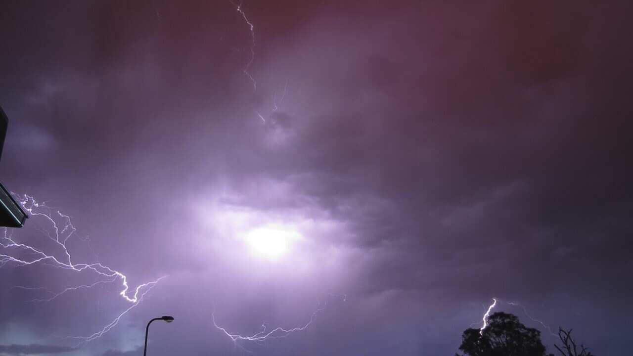 Lightning near Wodonga on the evening of Monday, Dec. 15, 2-014. The lightning sparked a bushfire which has burned 170ha and is approaching homes at West Wodonga. (AAP Image/Twitter/Celicajim) NO ARCHIVING