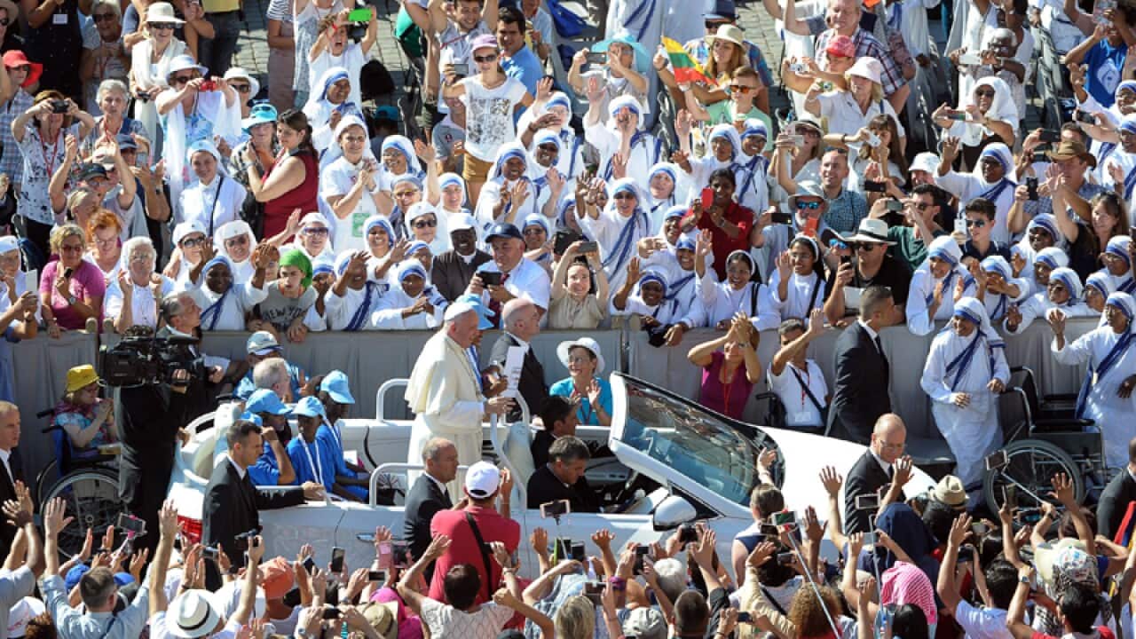 Pope Francis is driven through the crowd in St. Peter's Square