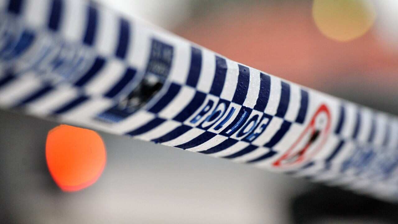 Police tape restricts access to a crime scene north of Sydney