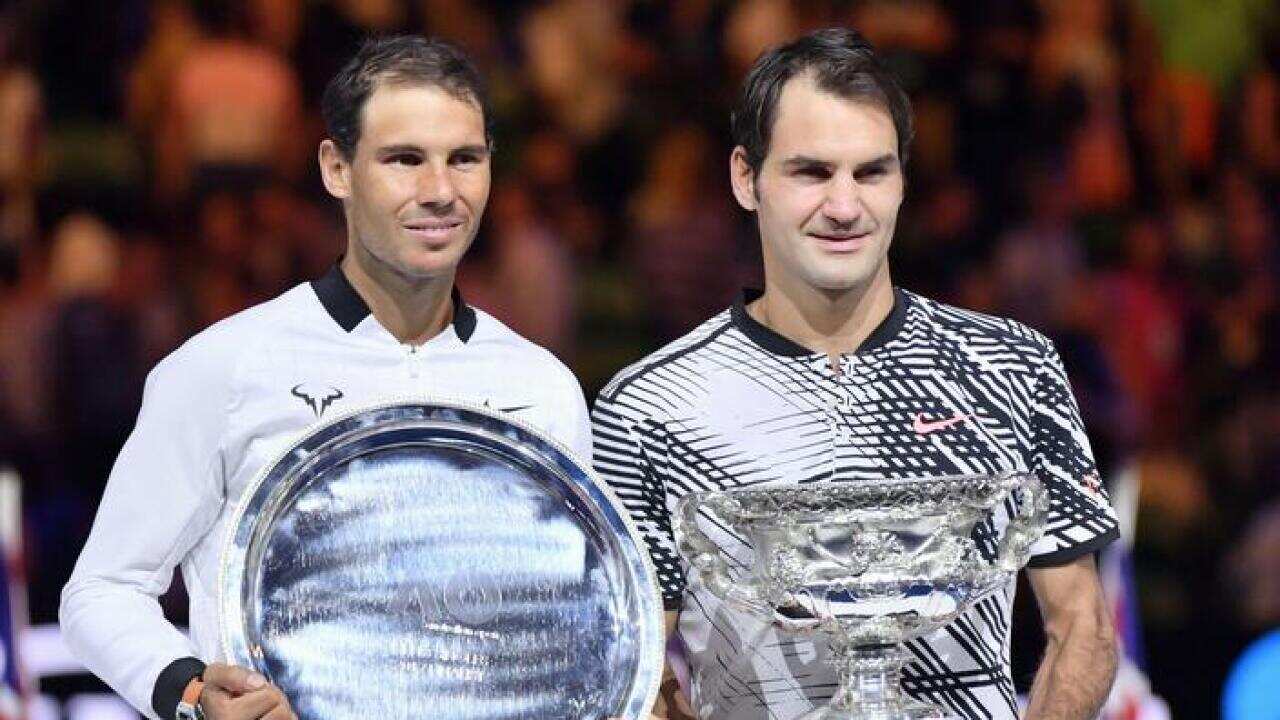 2017 Australian Open Champion Roger Federer (R) poses with runner-up Rafael Nadal
