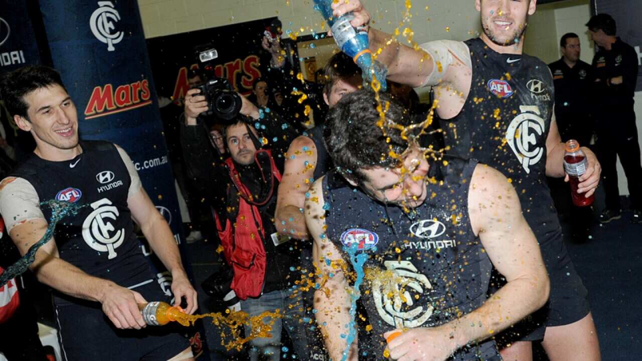 Carlton player celebrate