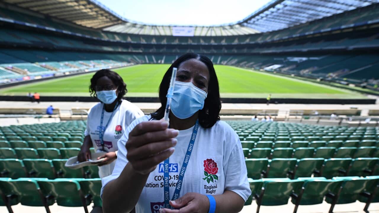 Covid-19 vaccination staff with a Pfizer jab at Twickenham rugby stadium